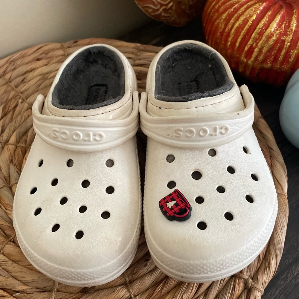 Size 13c white crocs with grey fur and one jibbitz.